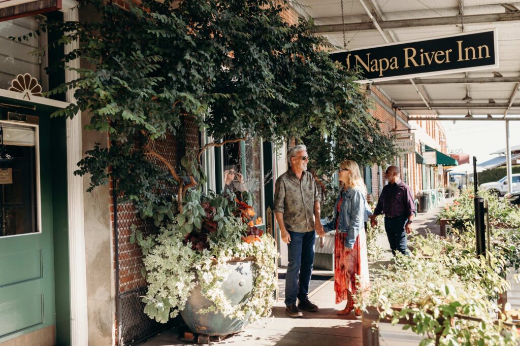 Visitors outside Napa River Inn hotel in downtown Napa’s Riverfront District.