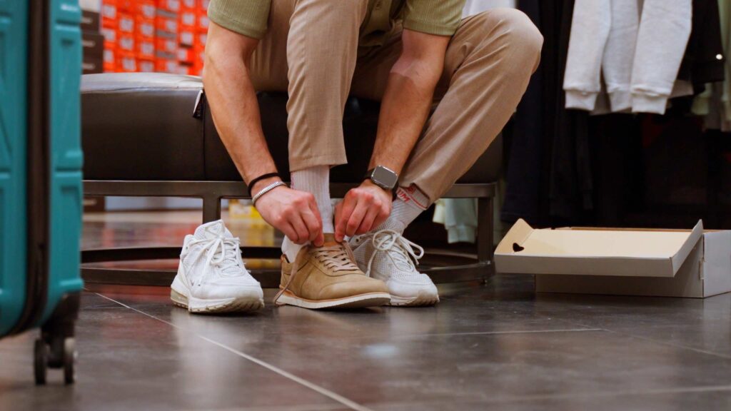 Trying on running shoes at a local Napa running store before race day.