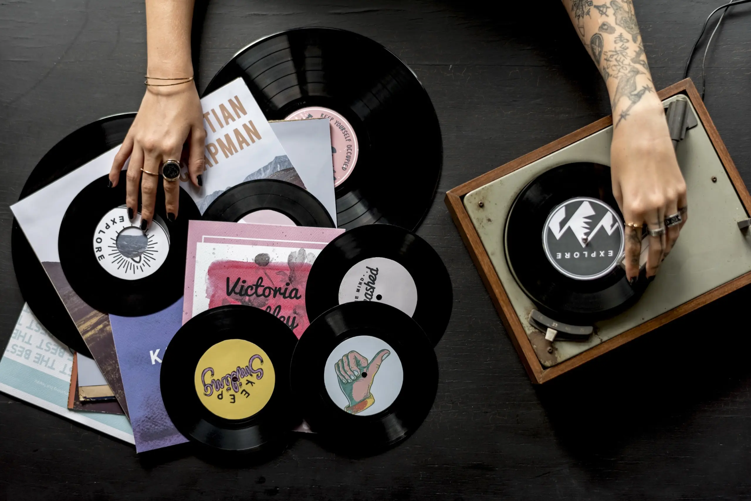 Overhead view of vinyl records and a record player, determining which Napa soundtrack you are.